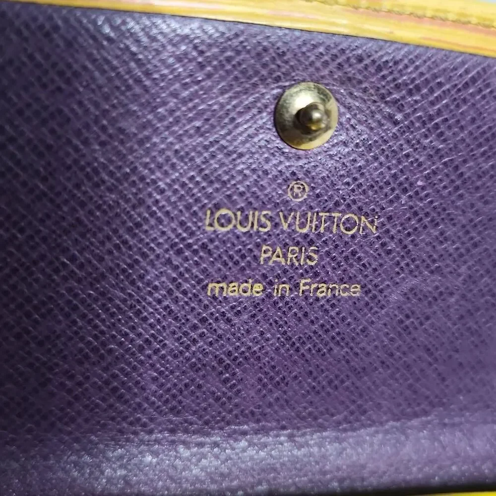Louis Vuitton Elise Trifold Wallet crafted from their signature Tassil Yellow Ep